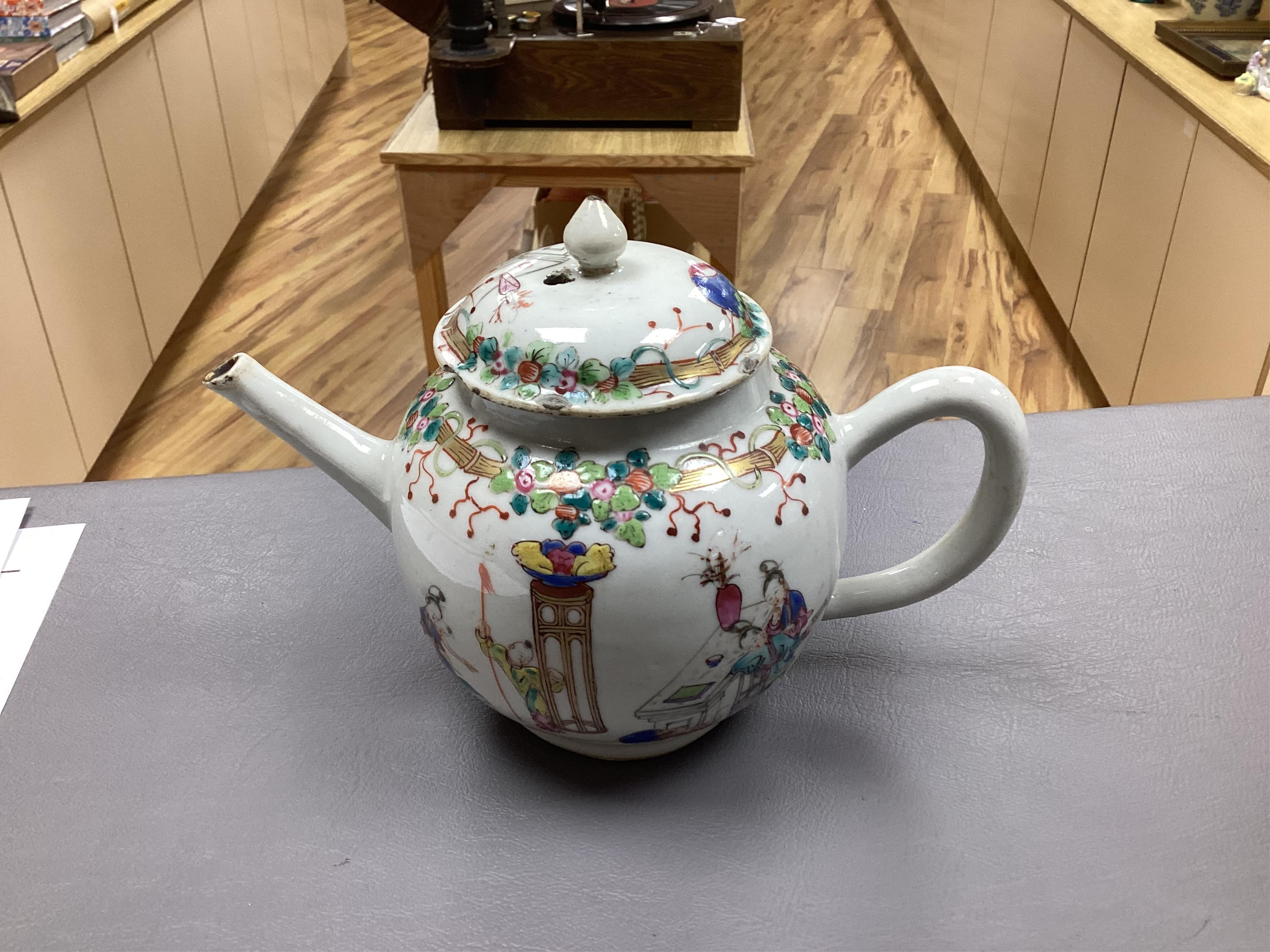 A Chinese famille rose ‘boys and ladies’ teapot, Qianlong period and a Japanese Arita sake pot or ewer, early 18th century, tallest 16cm high.